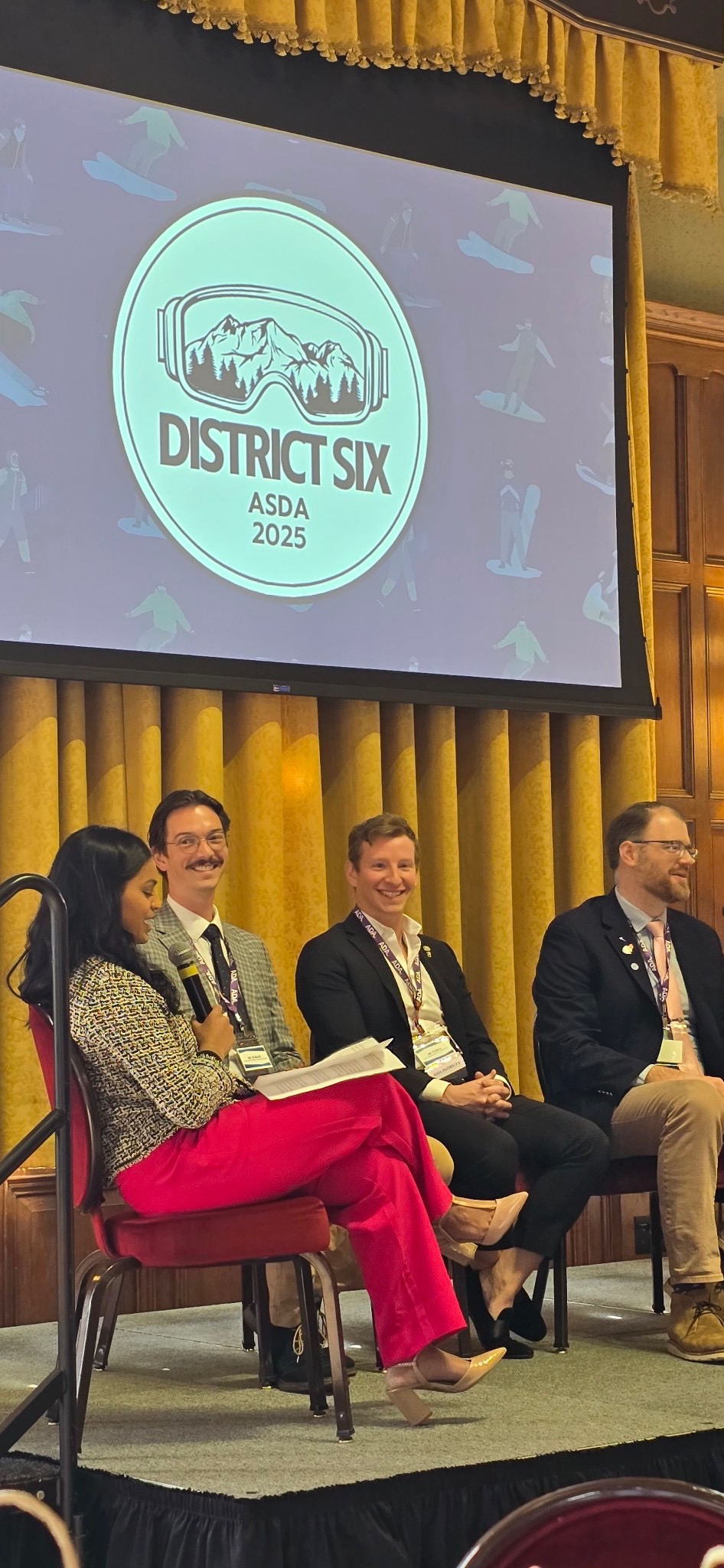 Jonathan Vogel seated at a dental leadership panel